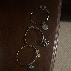 Alex and Ani Gold Bracelet with Blue Charm